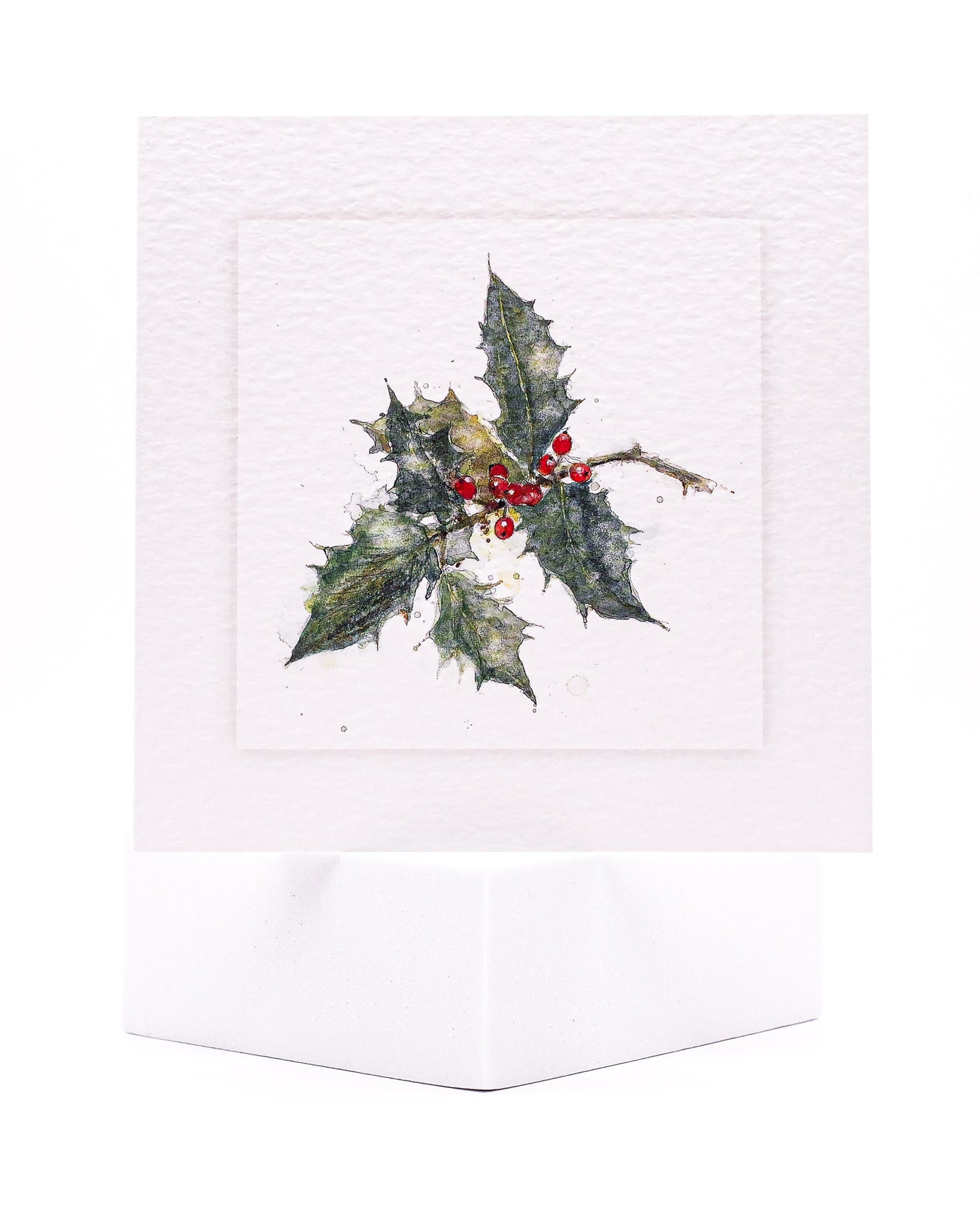 Christmas card design of holly painted with watercolour by Sarah Brown Cards
