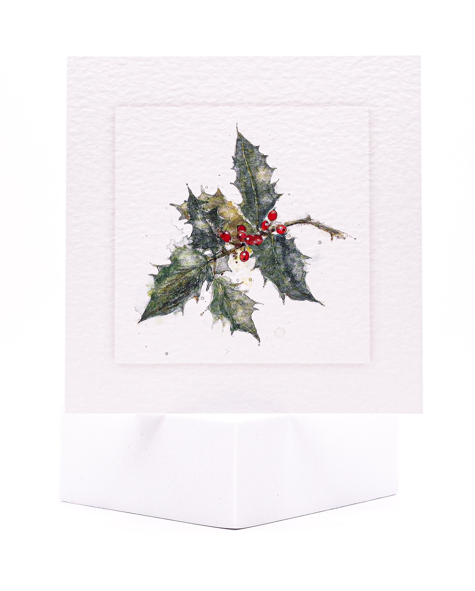 Christmas card design of holly painted with watercolour by Sarah Brown Cards