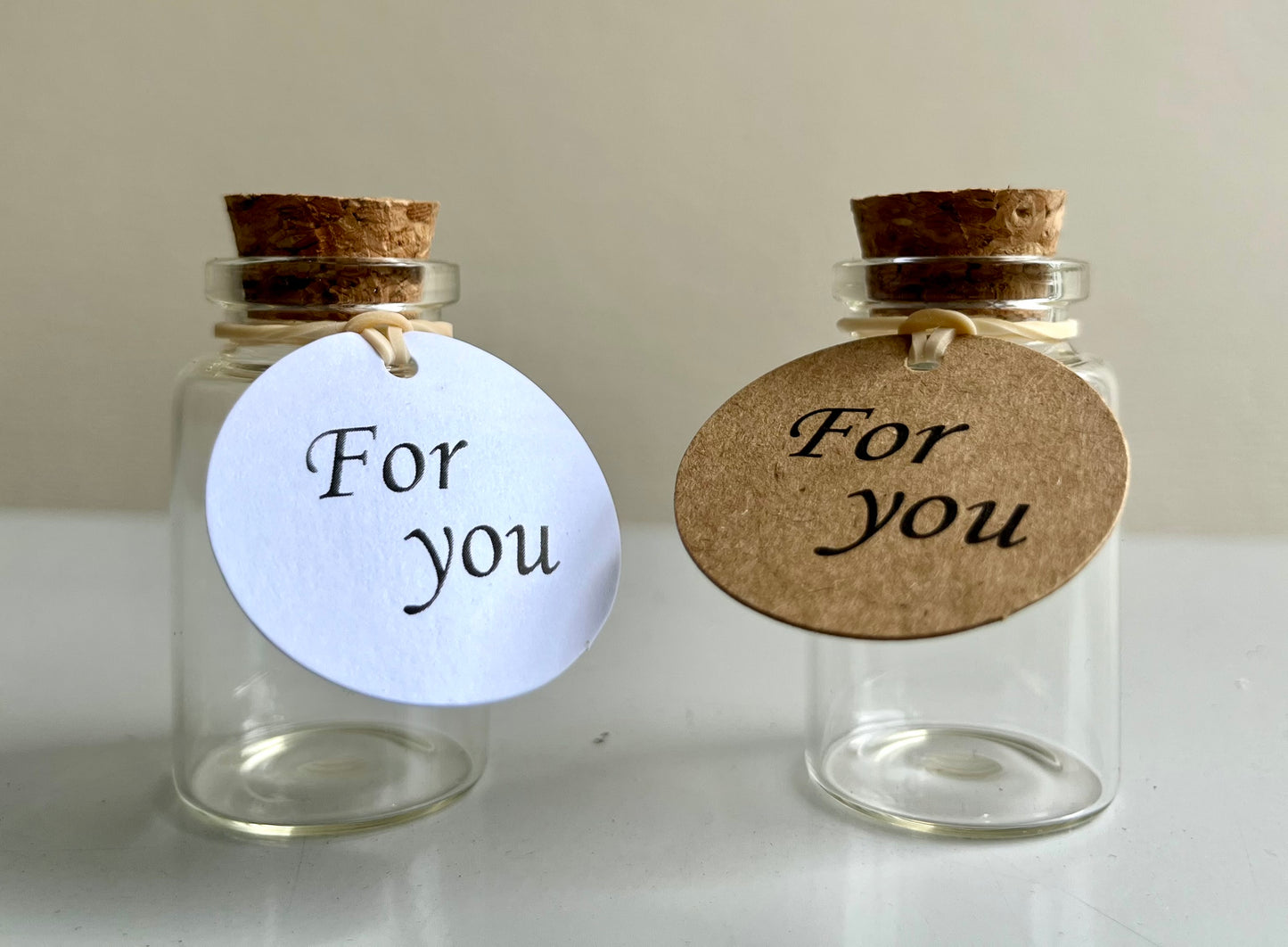 Two Pet Hair Memorial Glass Bottle with tag and cork lid by Sarah Brown Cards