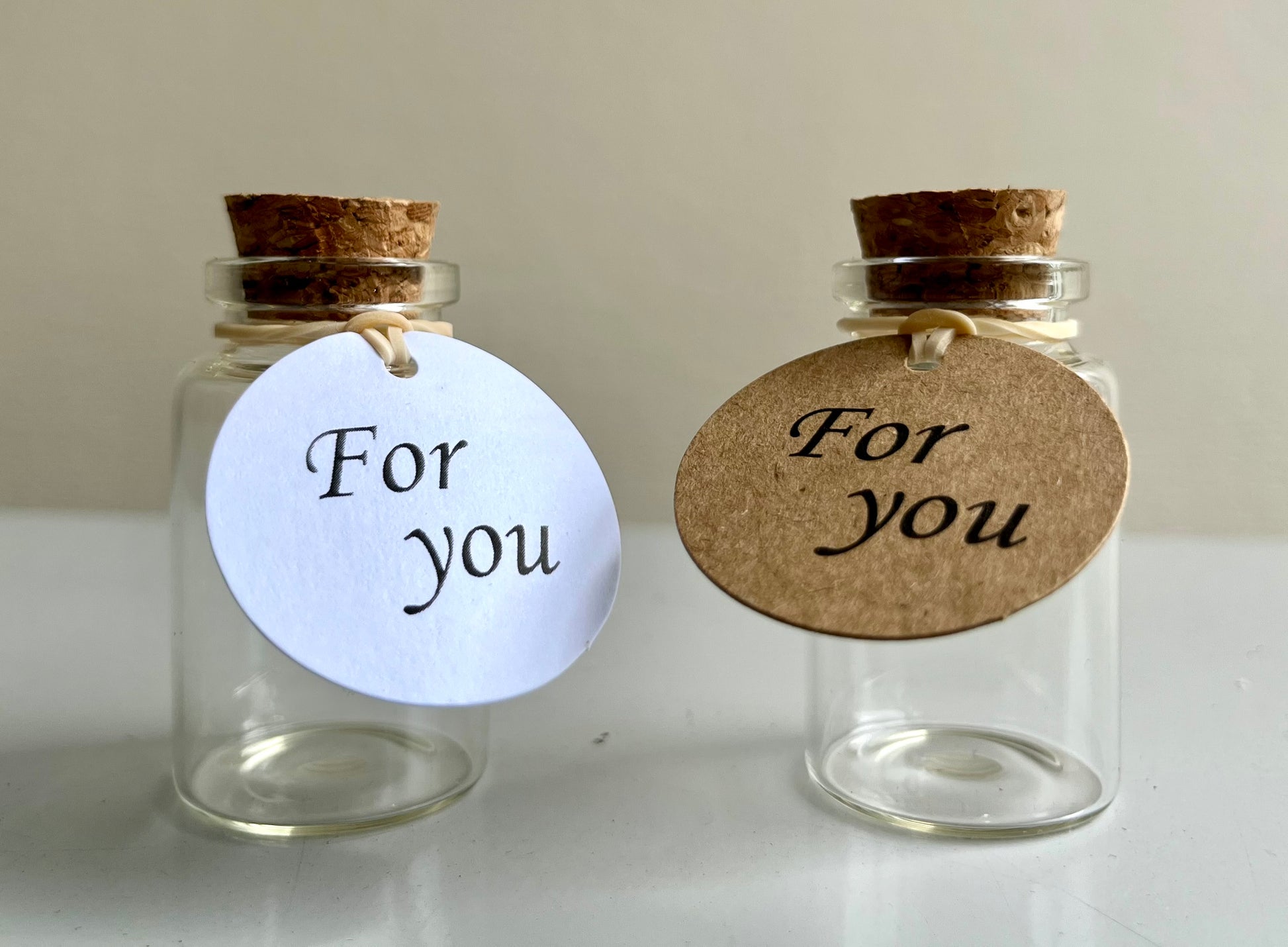 Two Pet Hair Memorial Glass Bottle with tag and cork lid by Sarah Brown Cards